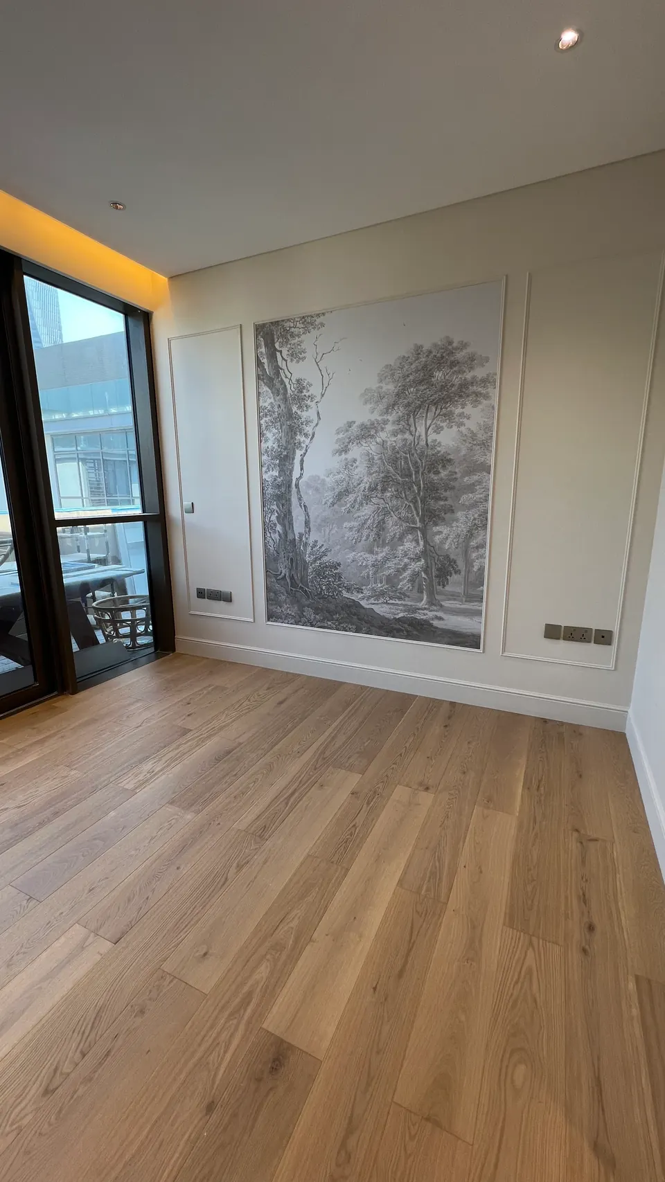 Room with wood flooring and a landscape wall panel, City Walk