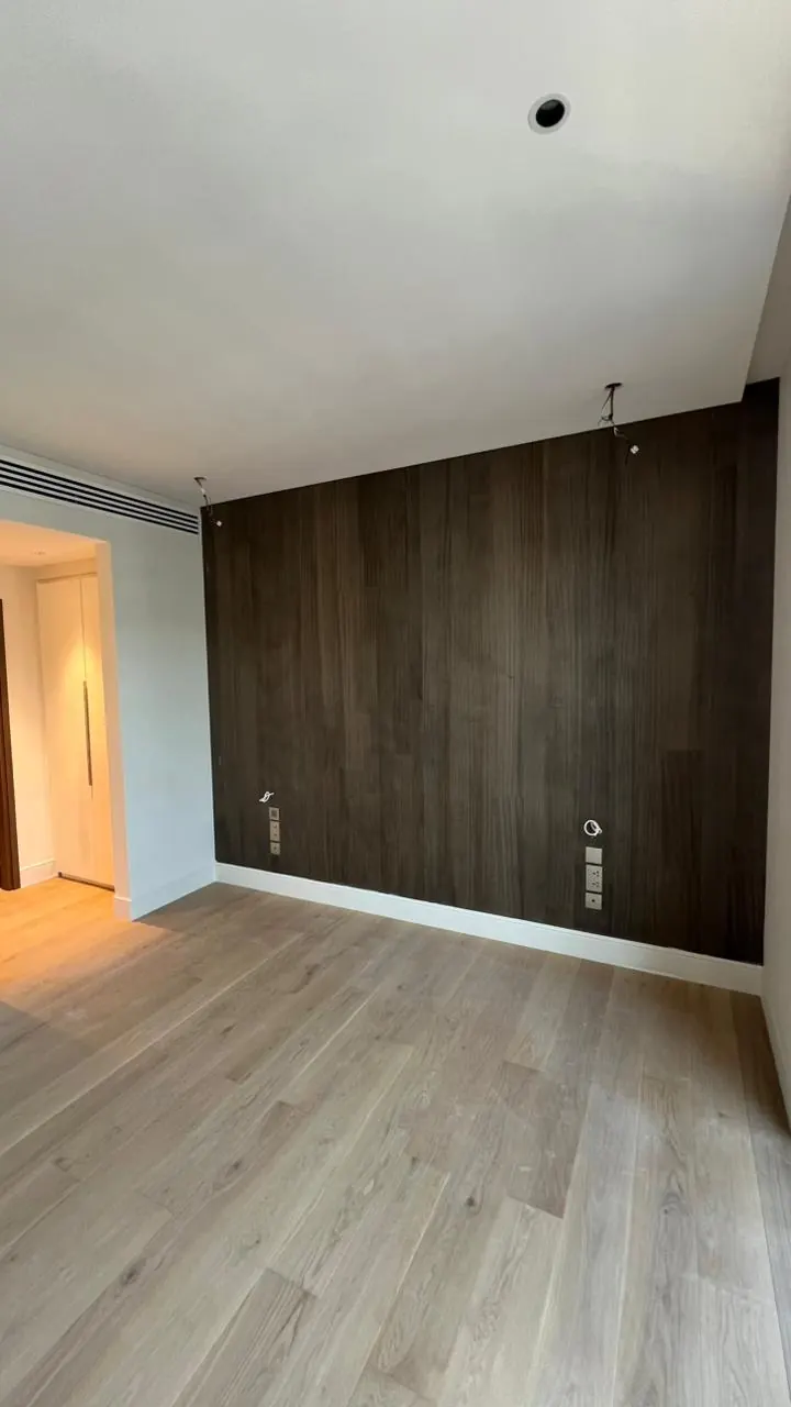Room with a dark wood accent wall, City Walk
