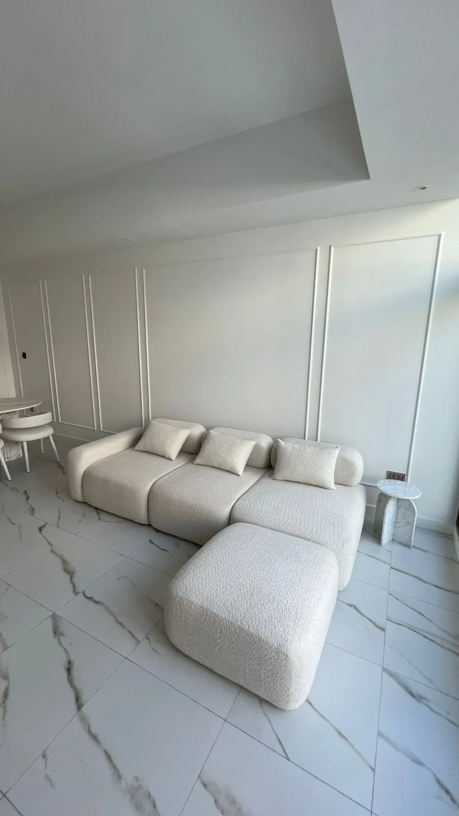 Living room with wall mouldings and a modular sofa, Wadi Al Safa 3